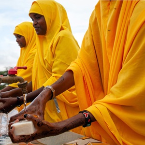 hand-hygiene-for-all-598x432 px A group of African women washing their hands with soap and water