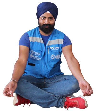 WHO Officer with turban sitting on the floor.