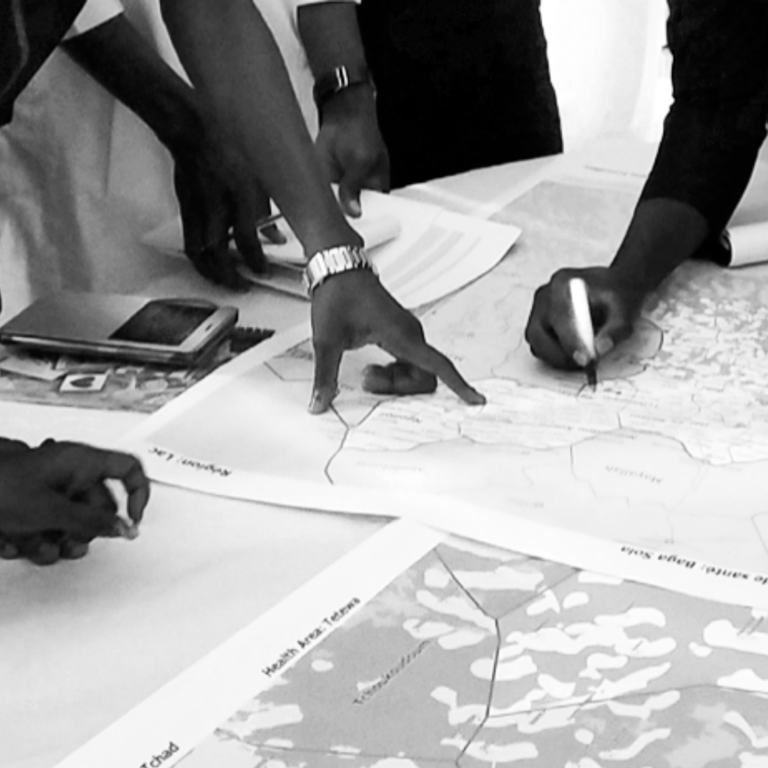 Hands pointing on a map