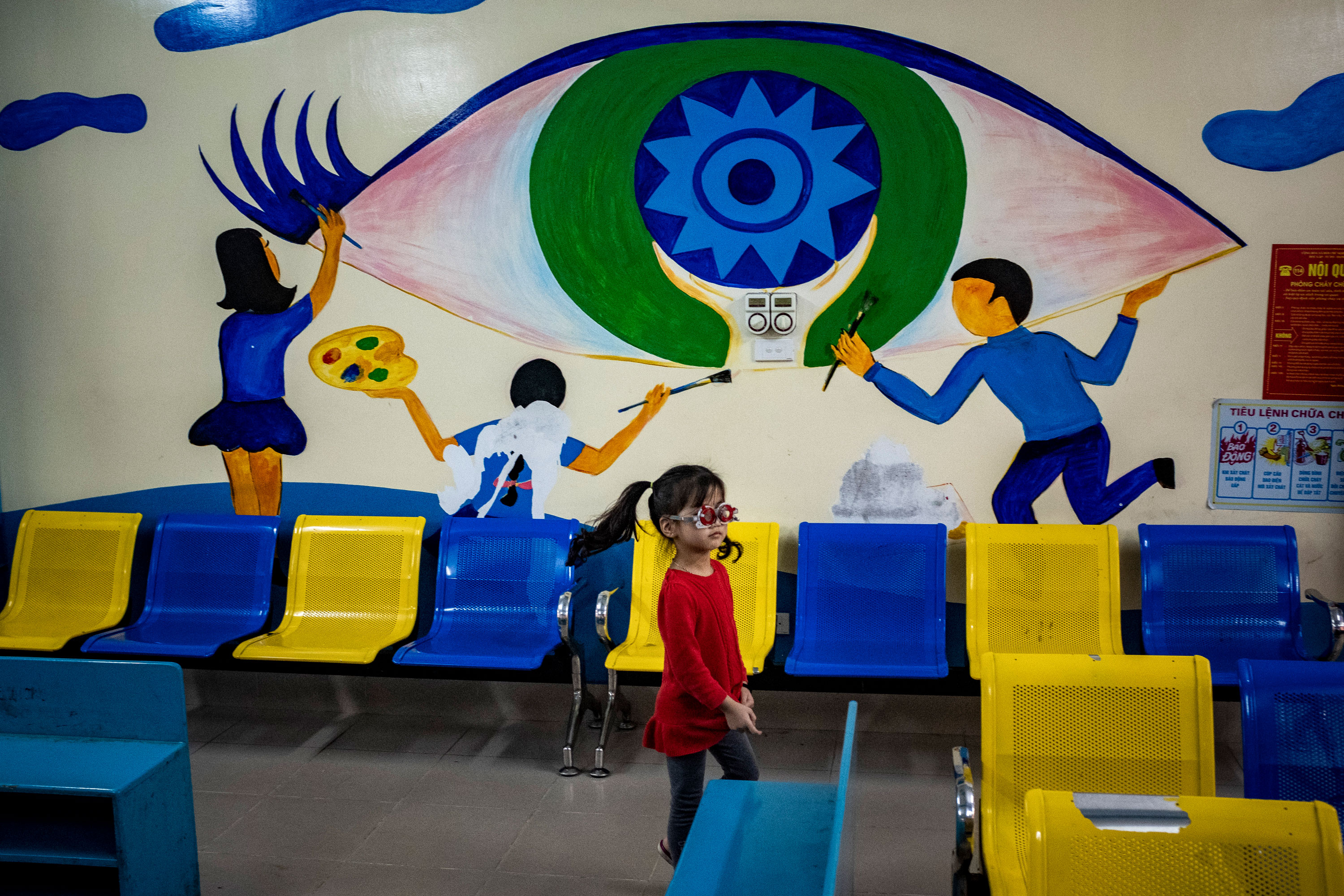 Little girl wearing rehabililtation glasses