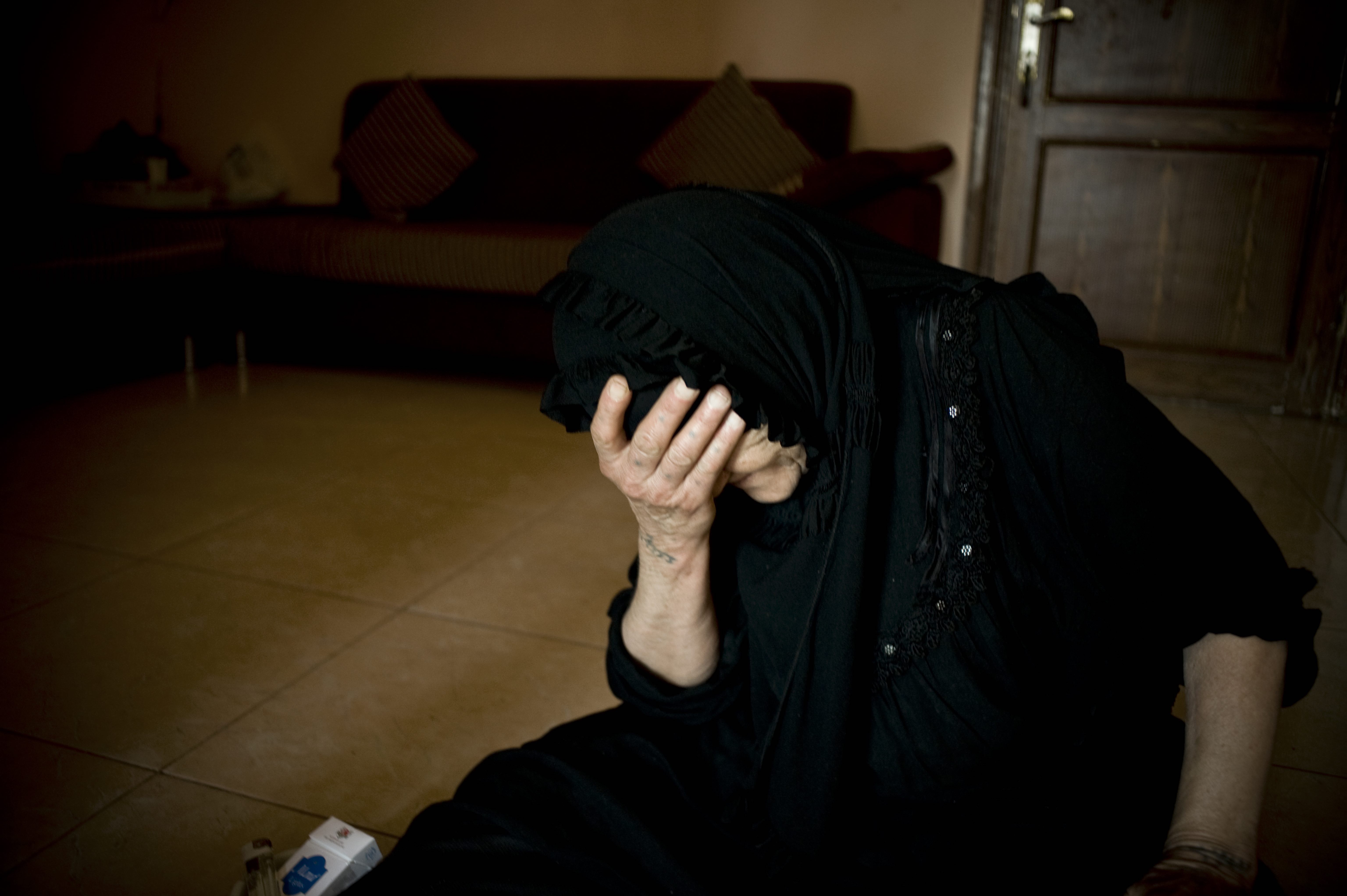 Mental health - woman Woman holding her head in her hand