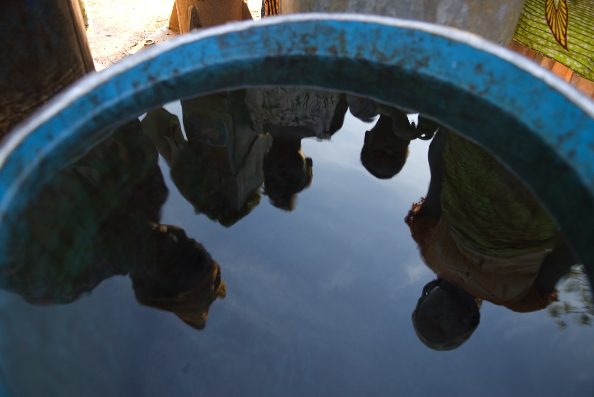 Reflections in a tank of water Ghana