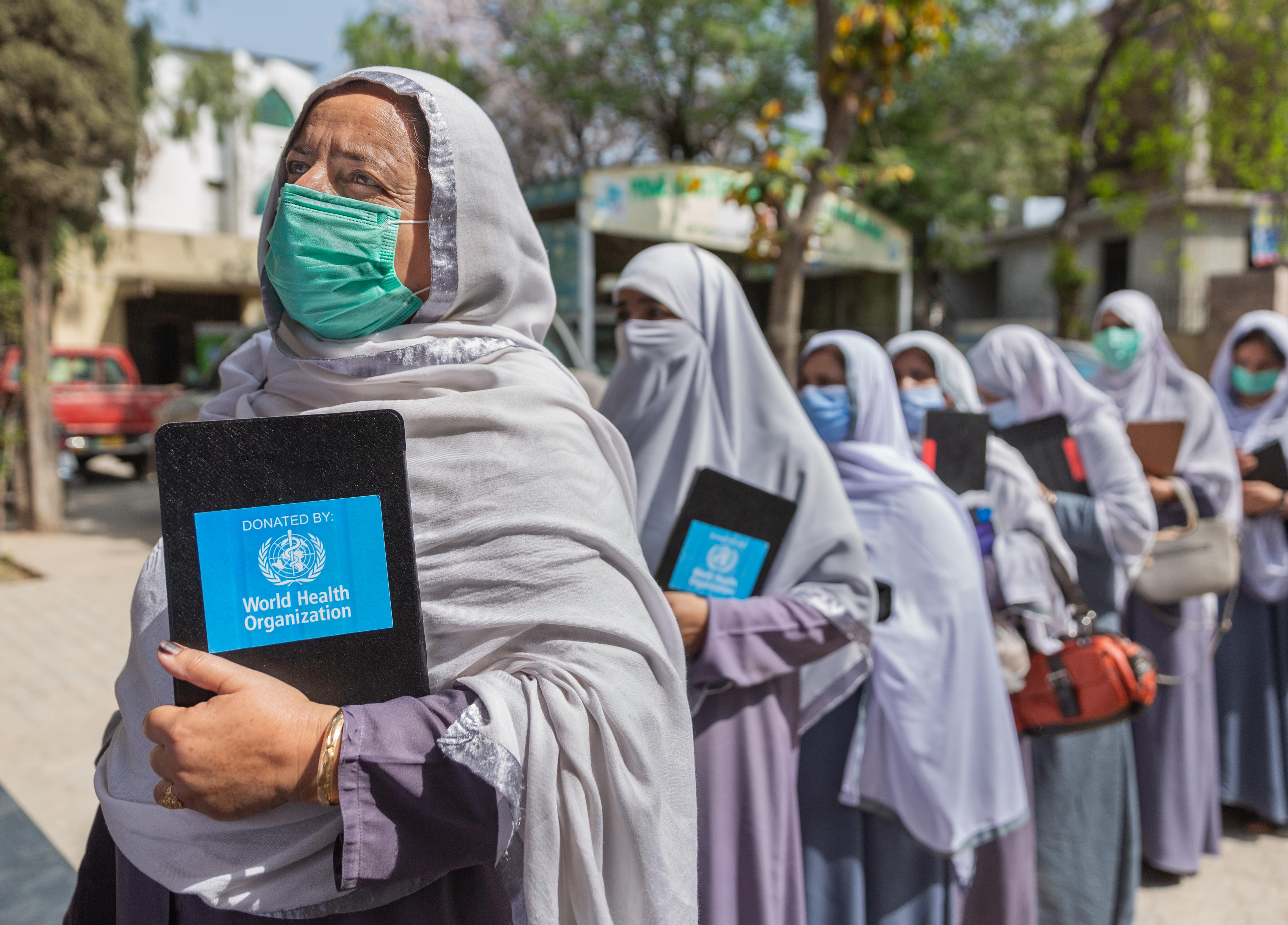 Health workers meet in Islamabad, Pakistan. They provide sexual and reproductive health services to their community, across the continuum of care.