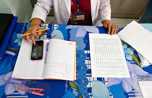 Person using mobile phone at desk