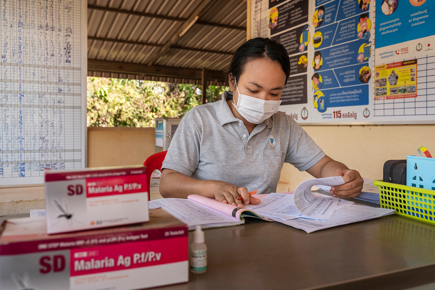 Health worker read registry book