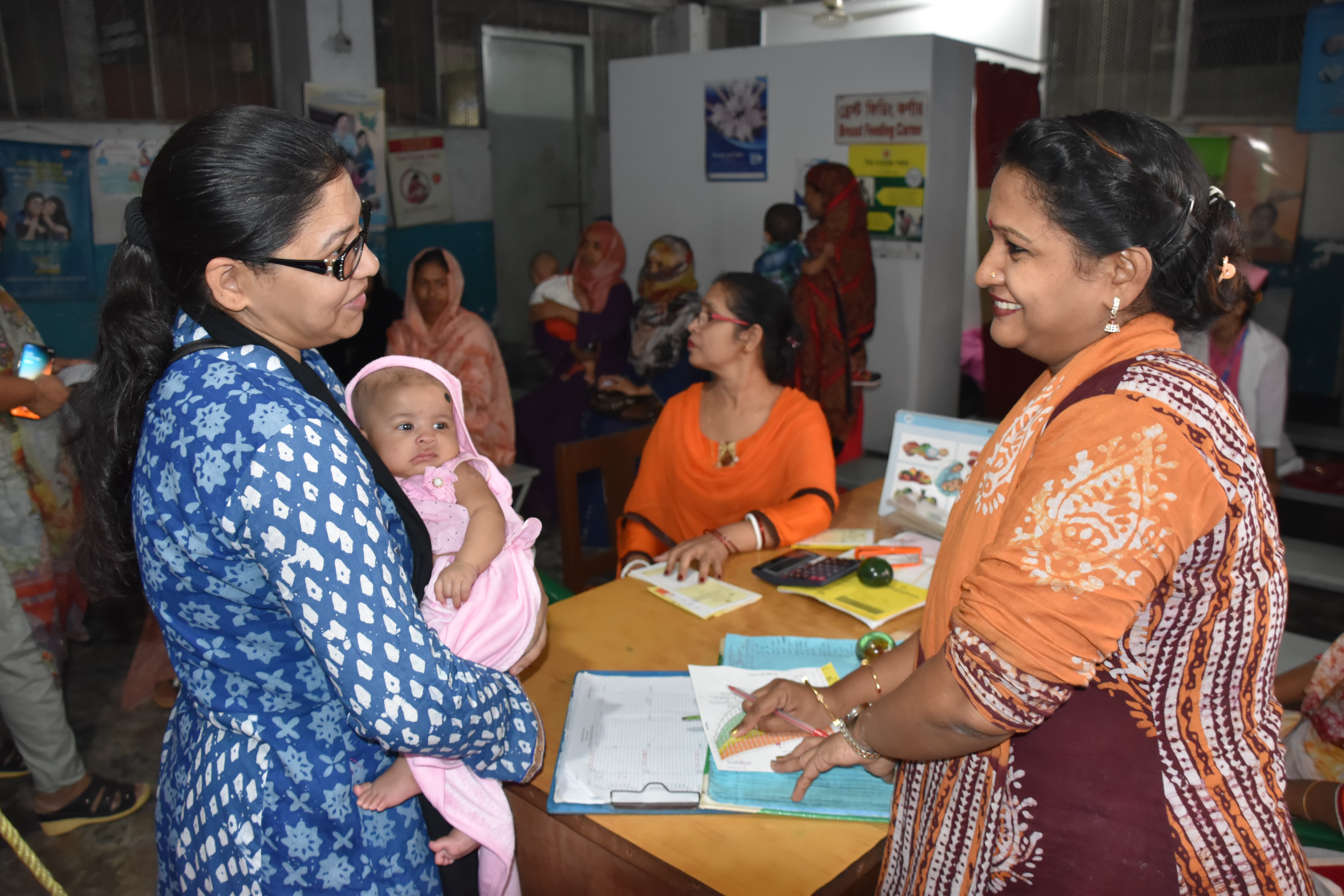 Asma , being counselled for next rounds of vaccination