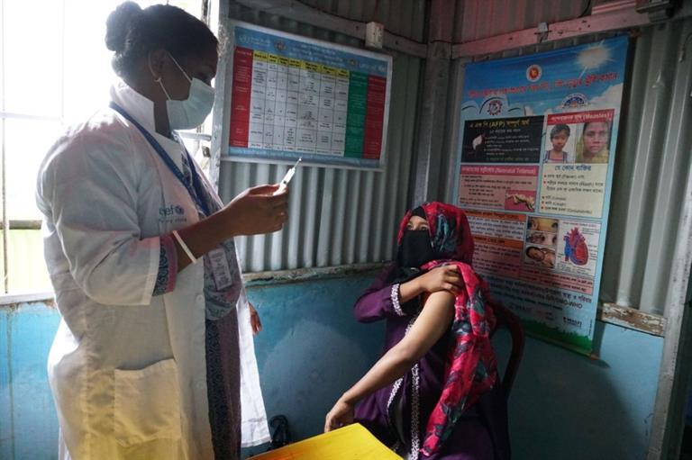 a community paramedic  working as a vaccinator in Ukhiya