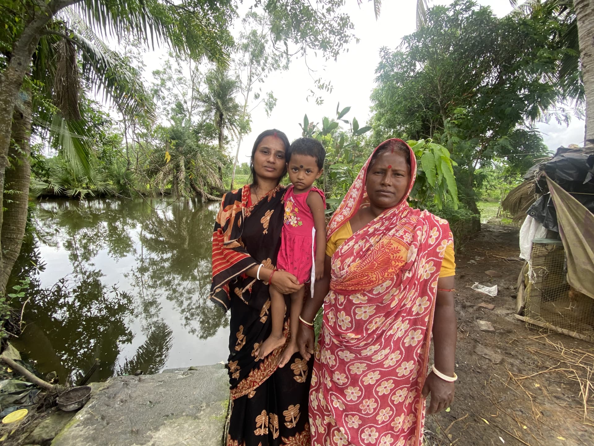 Sriti Mondal’s family (left to right, aunt, cousin and grandmother) still relive the horror and worry about other young children in community