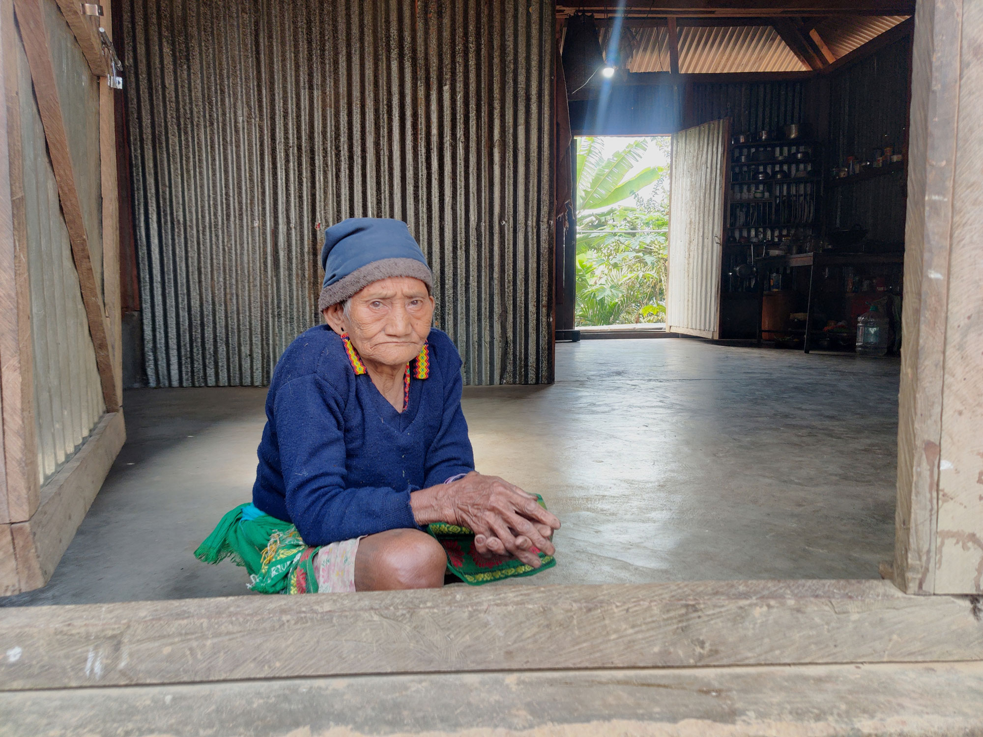 A matriarch in traditional bead earrings in the Community Centre kitchen, which also serves as a makeshift clinic for four hours every month