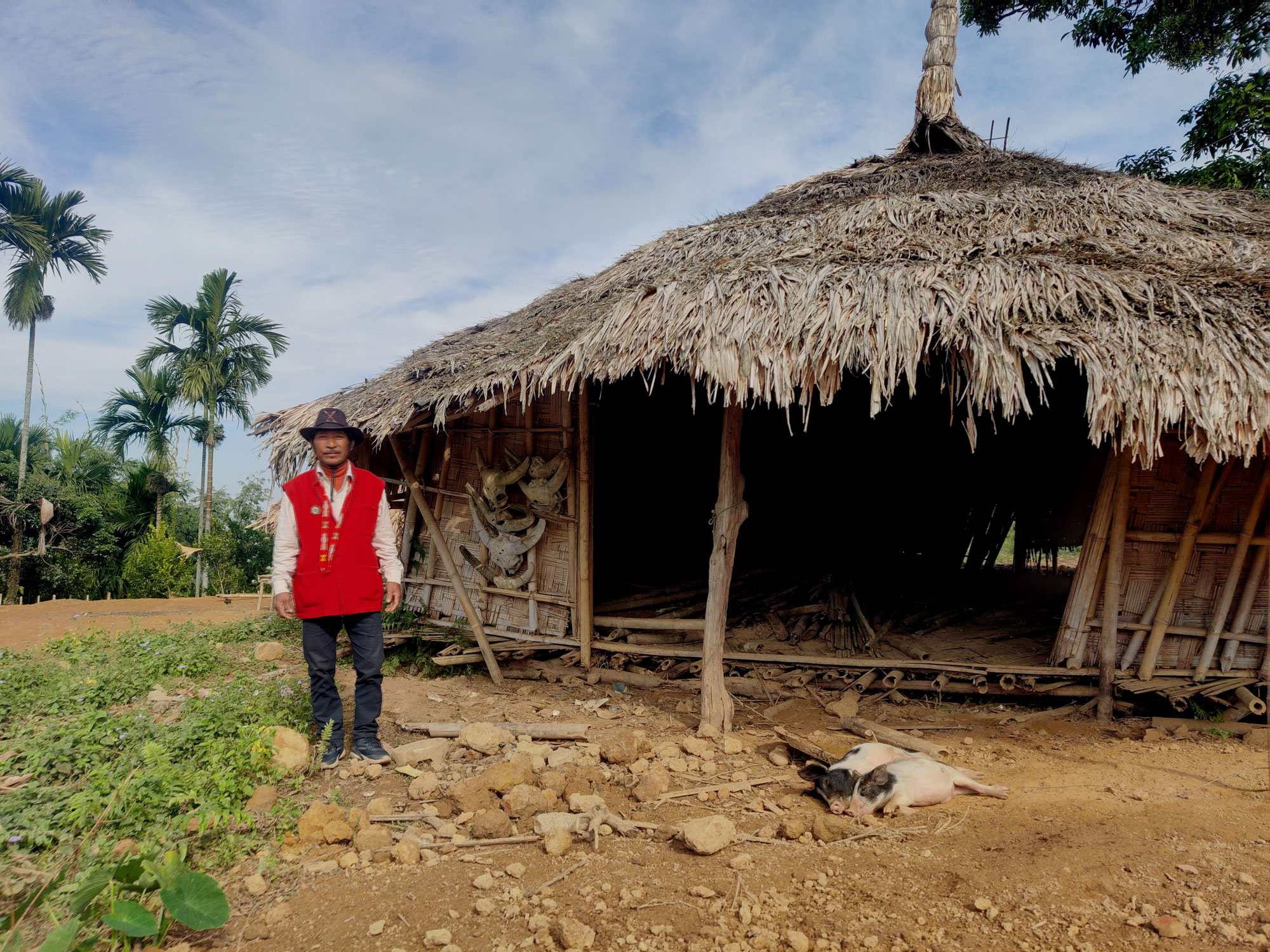 Chopnu headman Mr Ponwang Wangsu outside the disused village Morung, which women are still barred from entering.