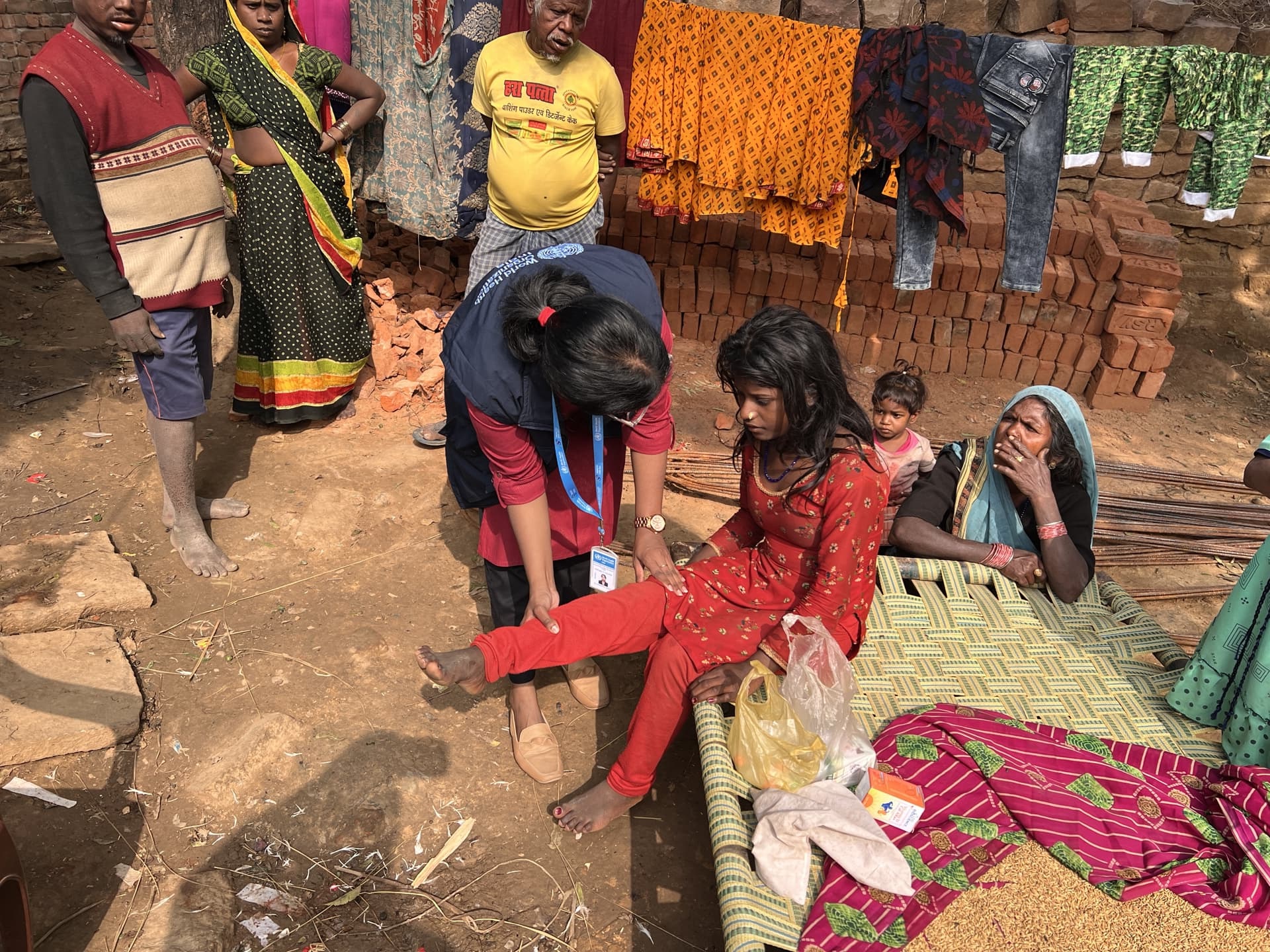 A WHO officer is conducting acute flaccid paralysis (AFP) case