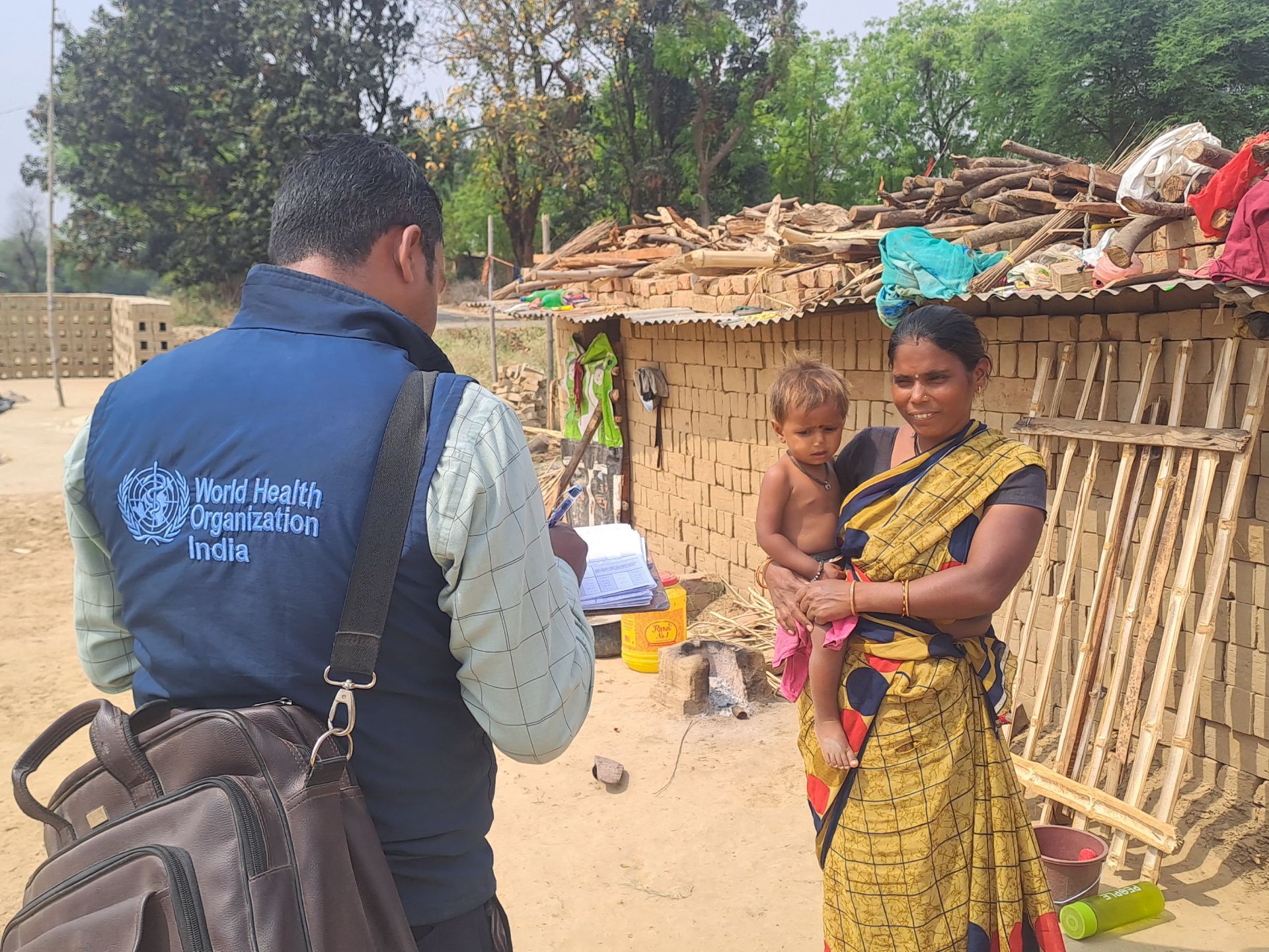 A WHO officer conducting house-to-house monitoring in Kaundhiyara village