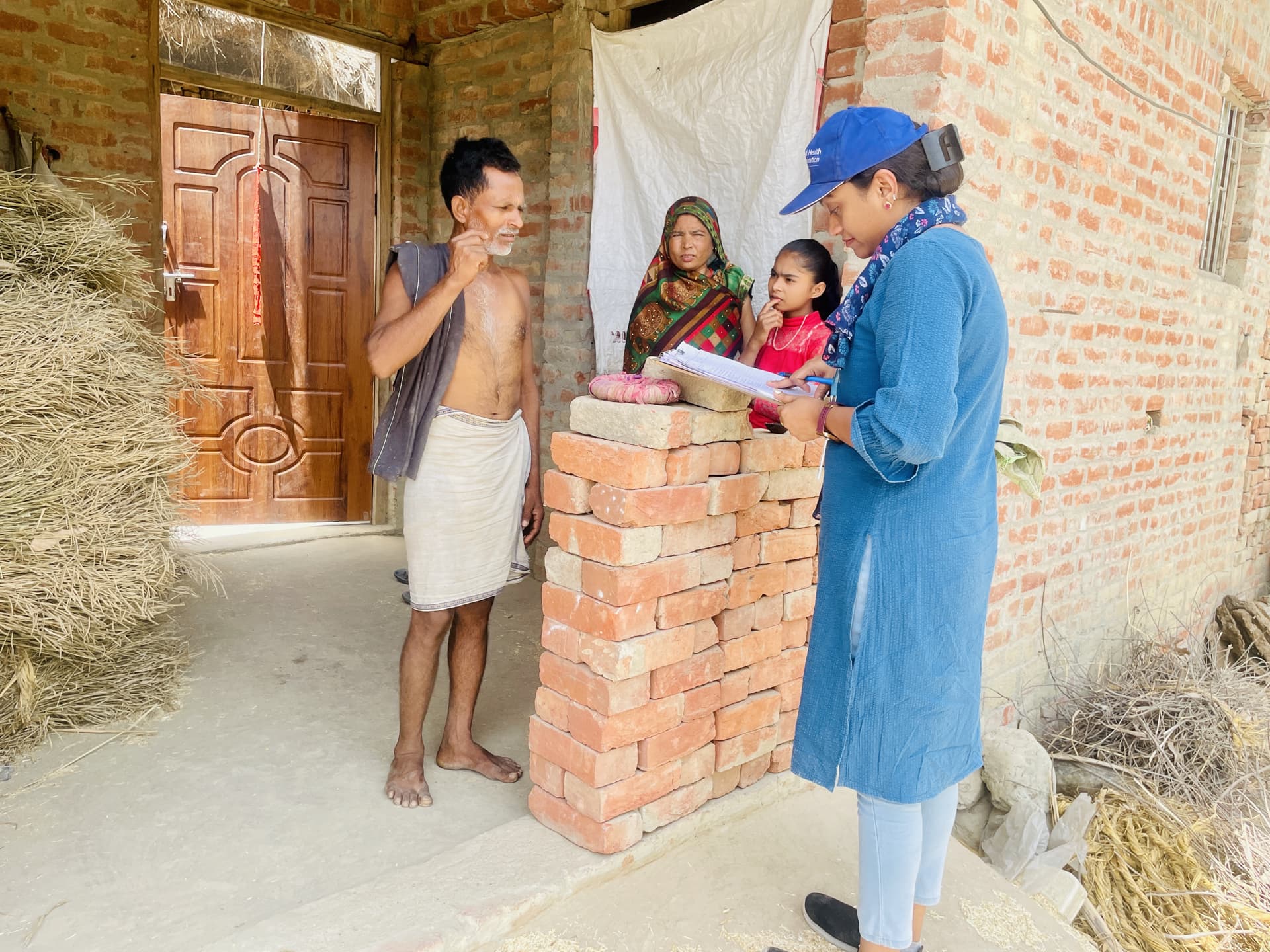 A WHO field officer conducting a house-to house-survey
