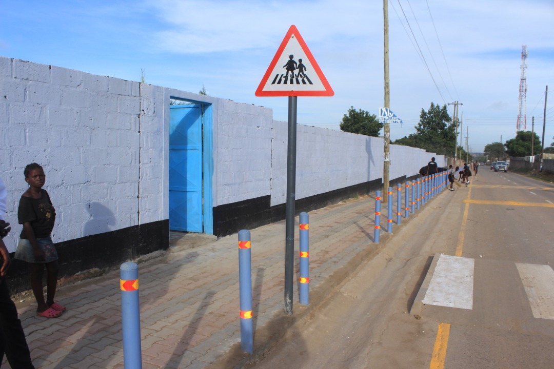 Child standing by pedestrian crossing