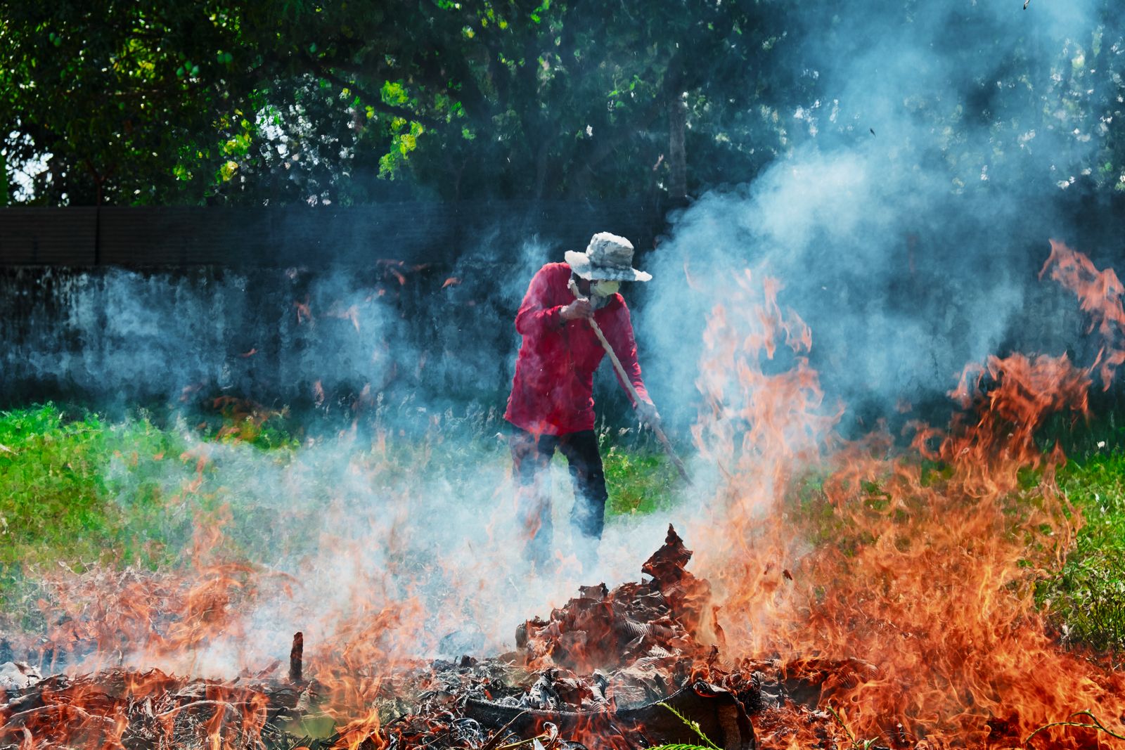 A man is burning waste