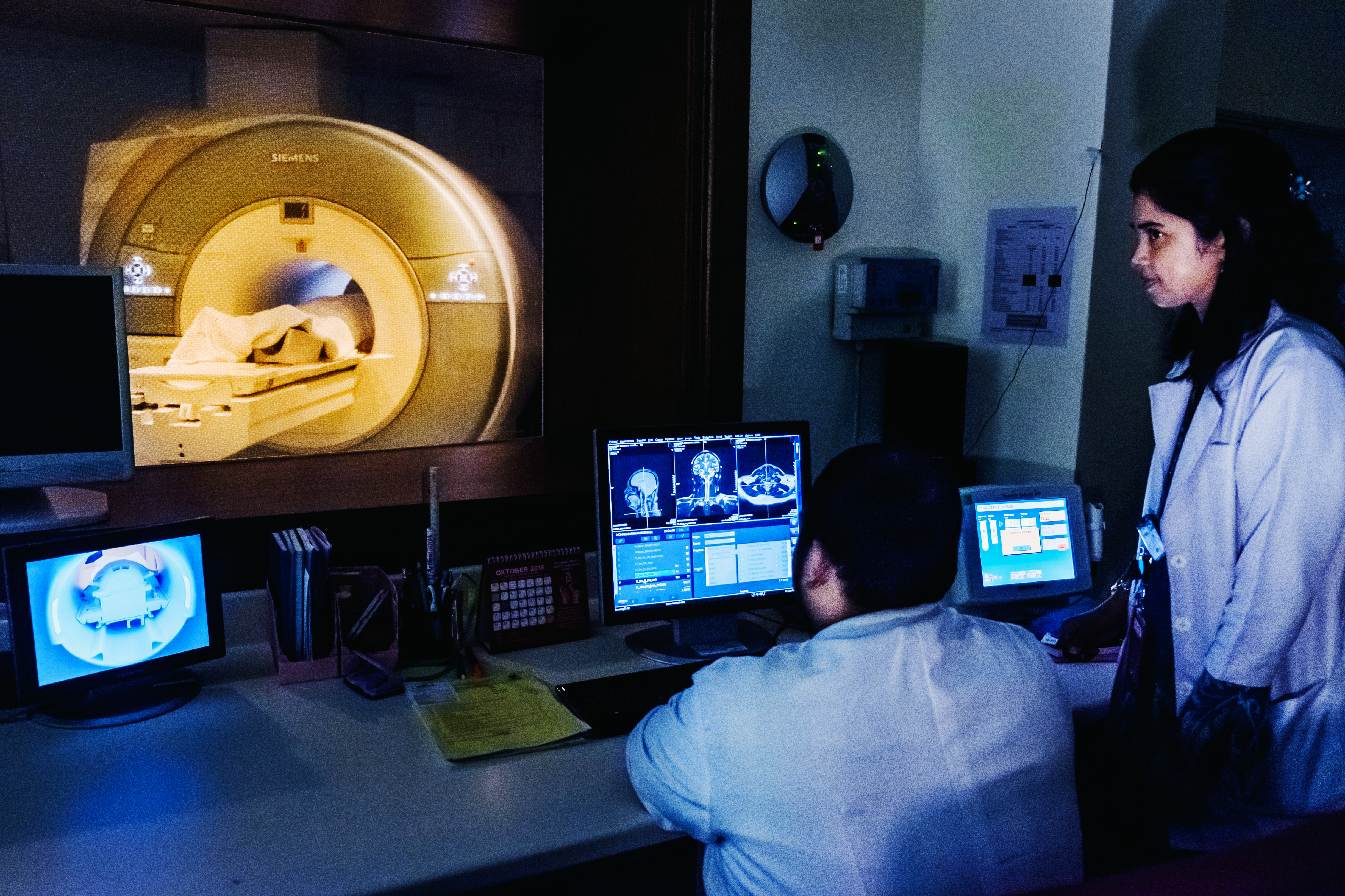 Scientists operating a CT scanner. 